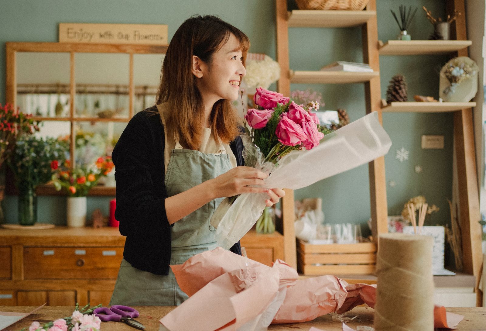 Florist preparing a bouquet in the studio